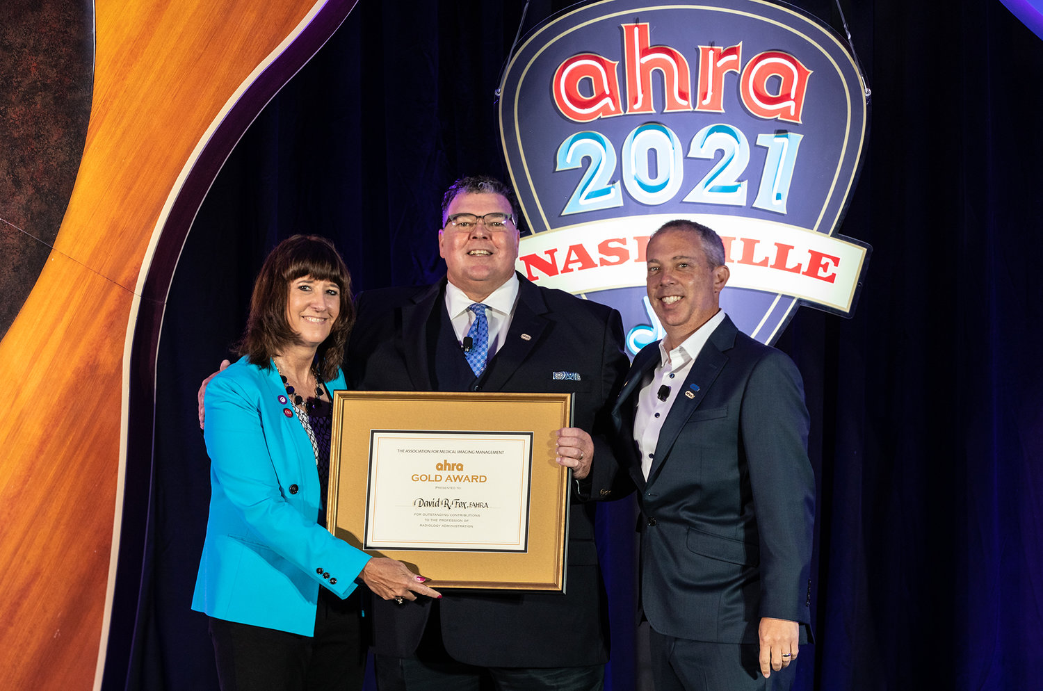David R. Fox, Baxter Regional VP/COO, accepted the AHRA Gold Award from Jacqui Rose, AHRA President, and Jason Newmark, 2020 AHRA Gold Award recipient, at an awards ceremony at the AHRA 49th Annual Meeting and Expo on Monday, August 2.