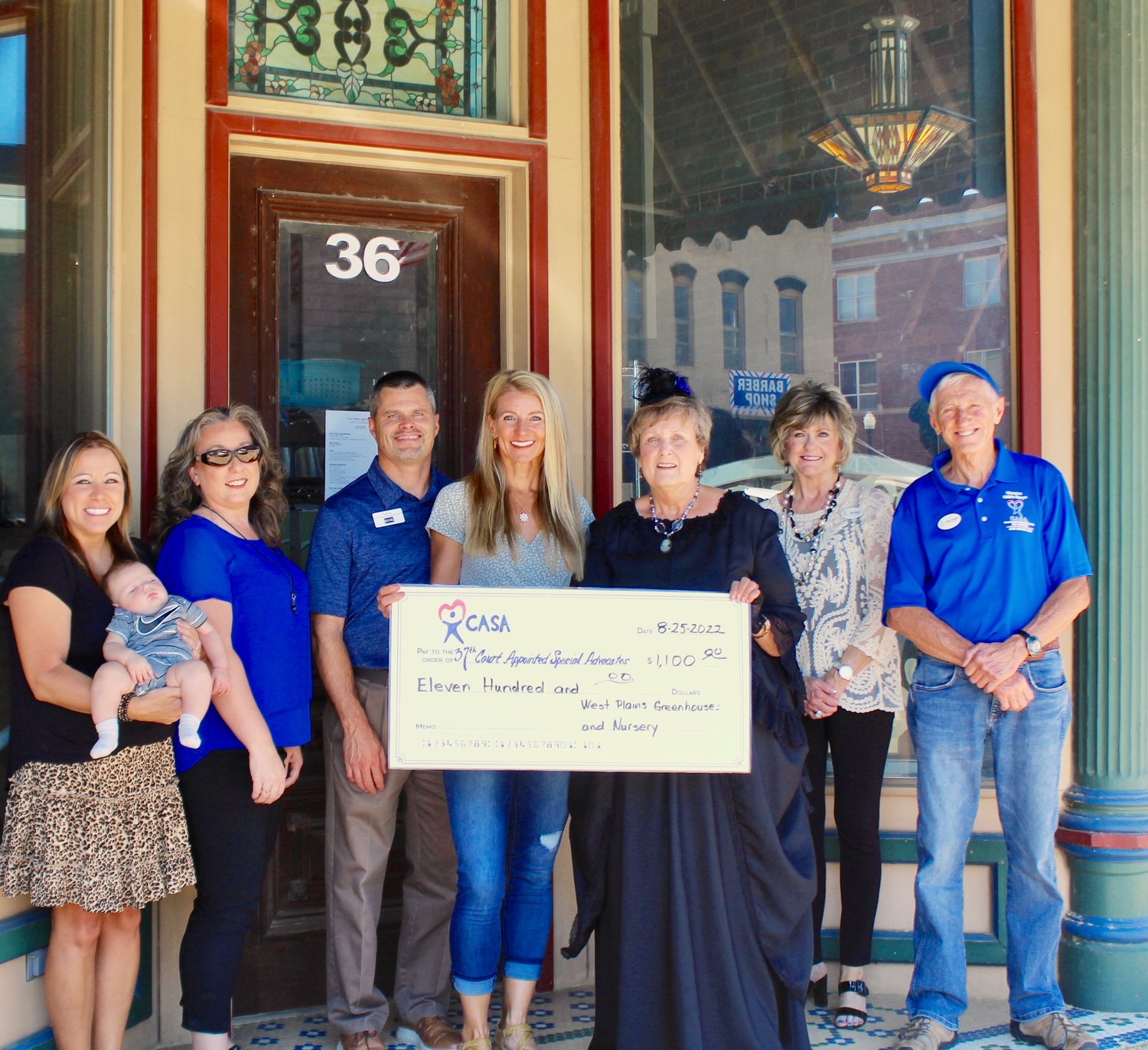 West Plains Greenhouses and Nursery has donated $1,100 to CASA for its fundraising event in September. From left: CASA volunteer Cheryl Murphy with grandson Luke, fundraising committee member Maggie Fielder, West Plains Greenhouse and Nursery owners Nathan and Lisa Cropper, CASA Executive Director Connie Pendergrass and board members Reta Reed and Marty Szigety.