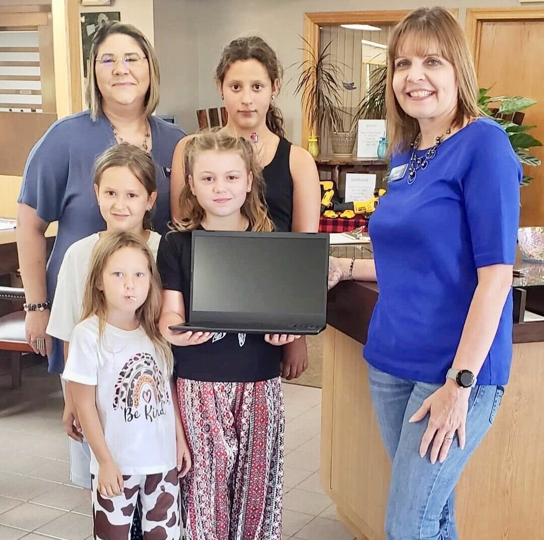 The Bank of Birch Tree branch of Alton Bank recently gave away four Chromebooks to students from each of the schools in Mtn. View-Birch Tree School District. The winner from Birch Tree Elementary was Laidynn Rector, holding the laptop and joined by friends, no names given, and bank employee Cindy Bradford, right.