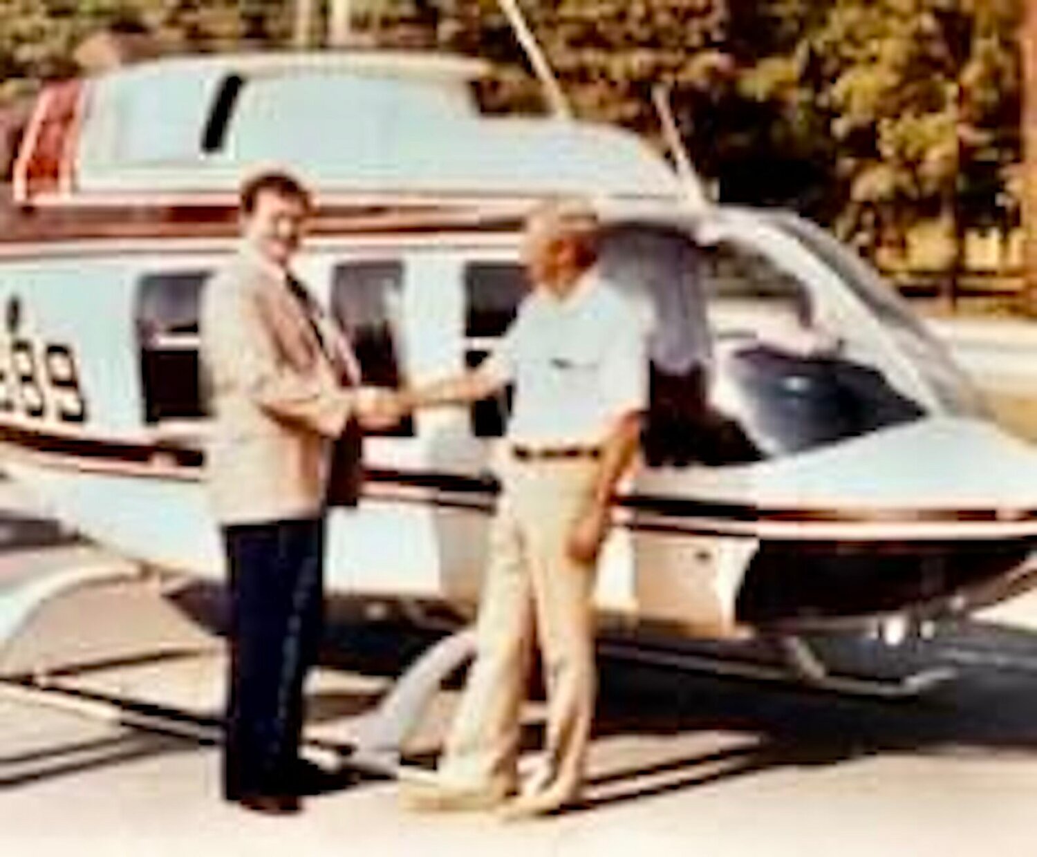 Bill (right) with the first Air Evac helicopter.