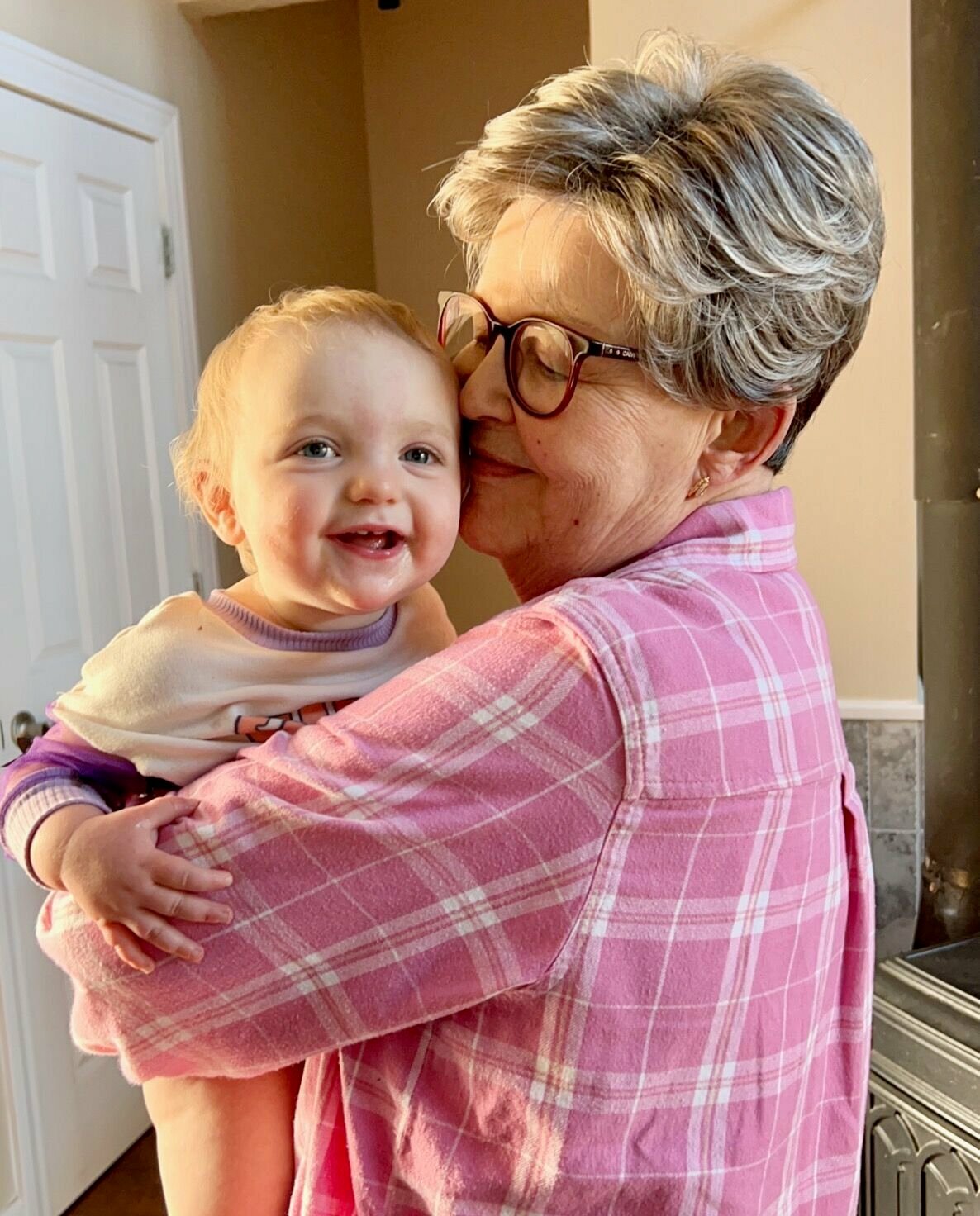 Ava Jonson enjoys a snuggle with her "Mema" (great-grandmother) Sharon Robbins.