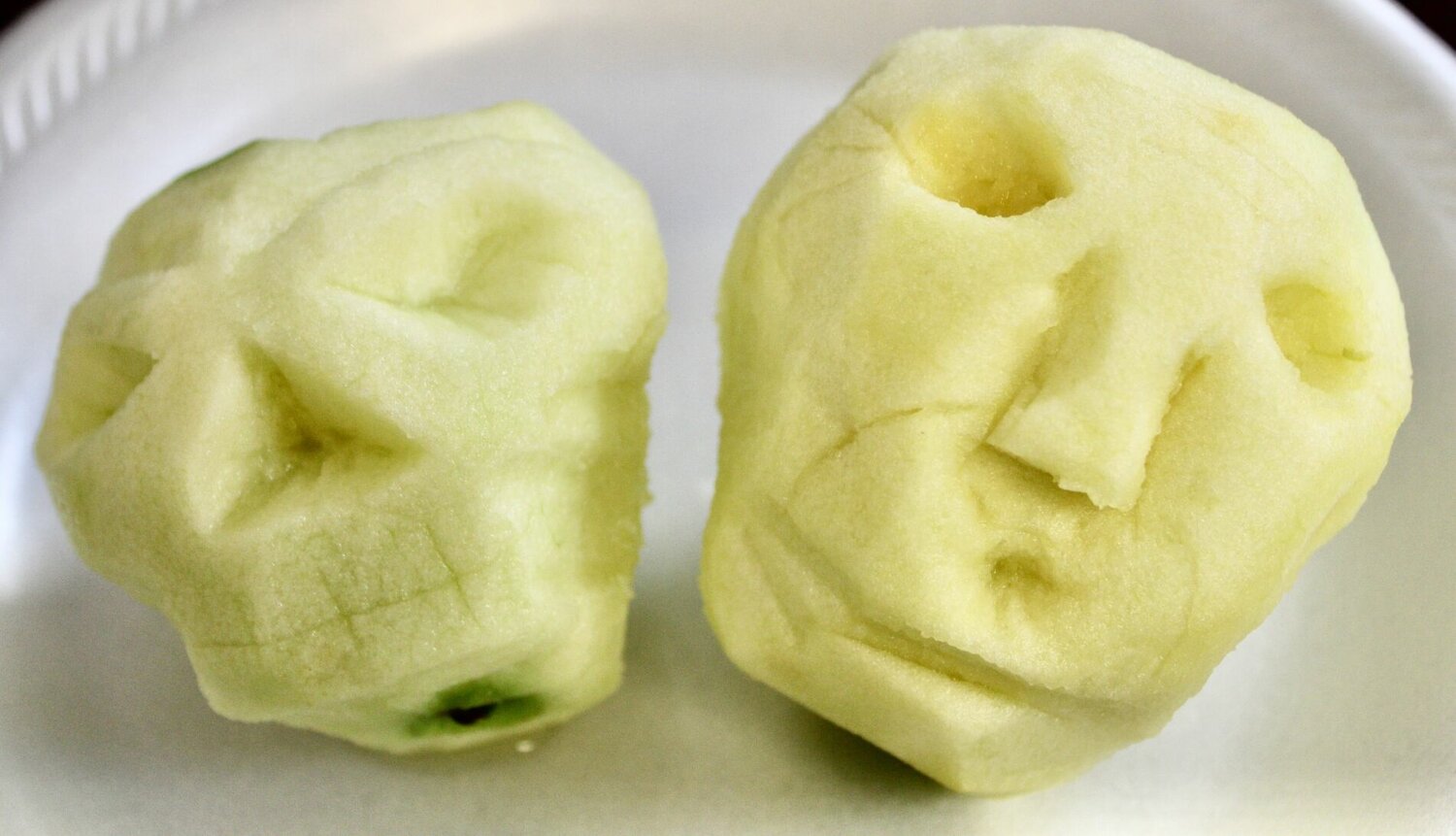 Freshly carved apple "heads."