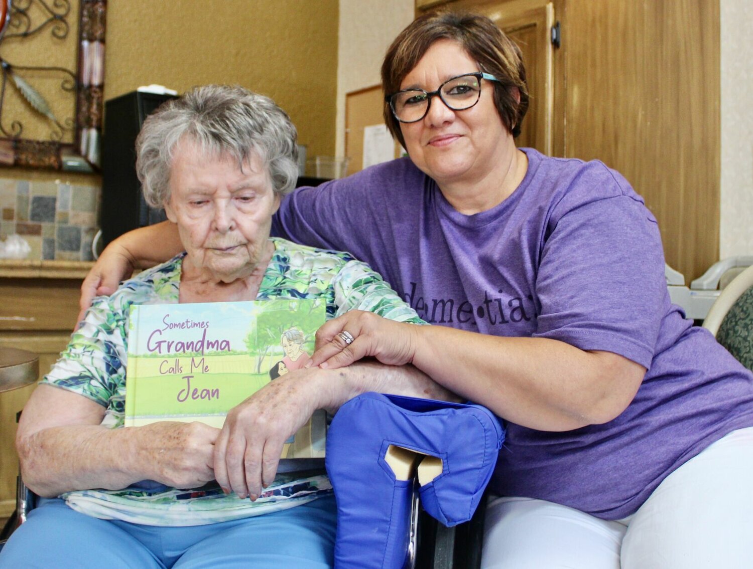 Bonnie Sullivant, left, is a dementia patient and resident of Brooke Haven Healthcare in West Plains. She holds a children's book about dementia, "Sometimes Grandma Calls Me Jean," written by her daughter, Jill Pietroburgo, right, and illustrated by Heidi Jean. Pietroburgo was inspired to create the resource after Bonnie's diagnosis, both as a method of coping and to help other families with children who might not understand the behaviors of loved ones suffering from dementia and other memory disorders. This photo was taken at a book launch party held recently at Brooke Haven in Bonnie's honor. It is available at Amazon.com in hardcover, and Pietroburgo will have copies available for sale at the upcoming Dementia Resource Event, 10 a.m. to 1 p.m. Saturday at First Baptist Church, 202 Walnut St. in West Plains; the Downtown Fall Block Party, from 4 to 9 p.m. Oct. 14 on Court Square in West Plains; and the Mistletoe Market at Pine Meadows Venue, from 10 a.m. to 3 p.m. Nov. 11, 1449 Highway 76, in Willow Springs.