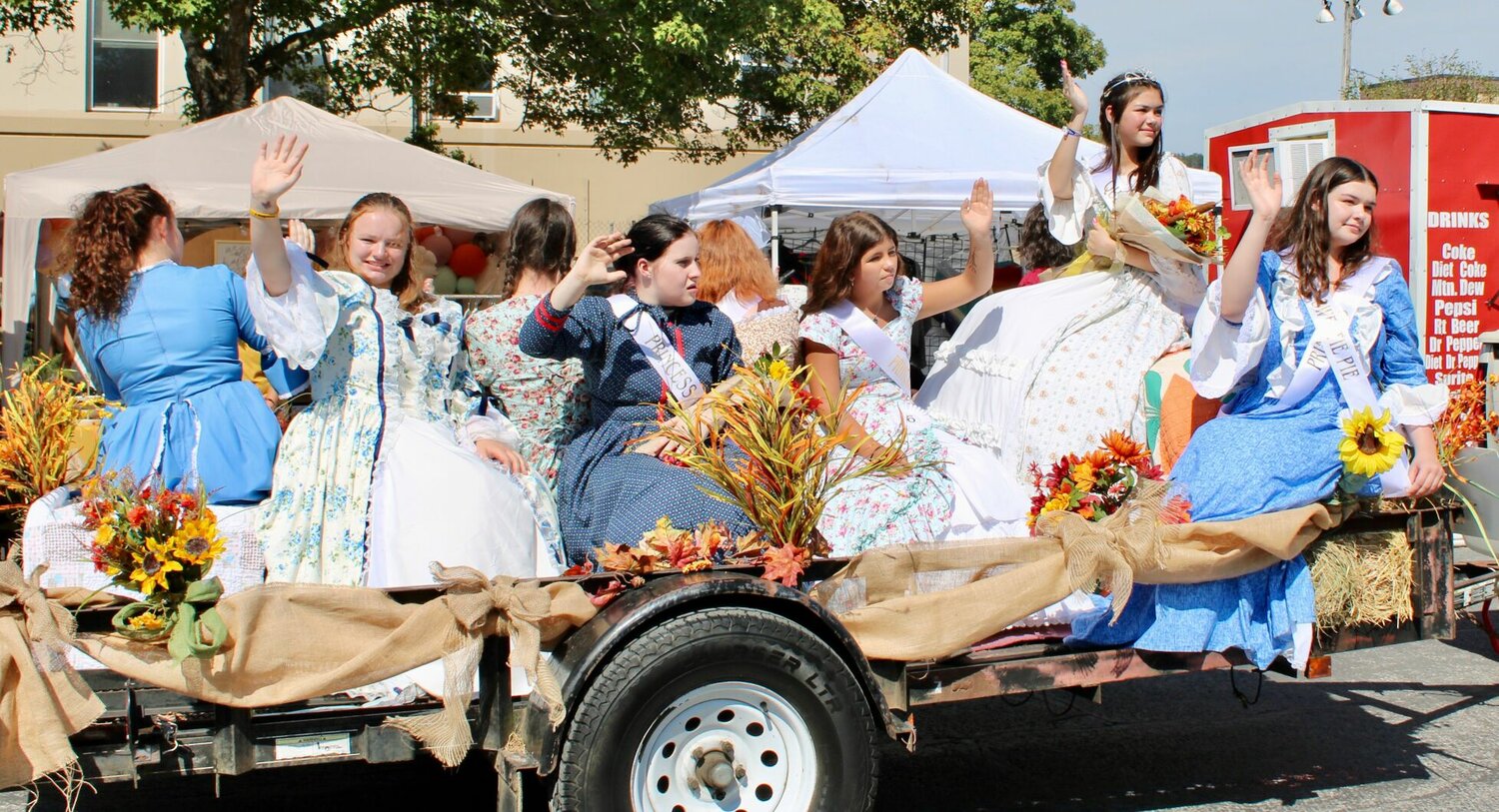 The 2023 Hootin' an Hollarin' Queen MaryJane Flygare, at second from right, and her court gave their best princess waves during the parade. Deputy Queen is Carrie Richer and princesses are Emily McClure, Lakely Anderson, and Cheyenne Wachtel. Miss Sweetie Pie is Joslyne Trout, at far right.