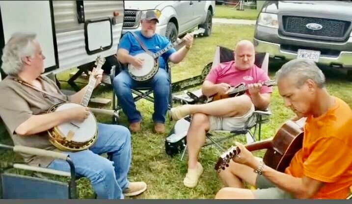 Two banjos and two guitars were brought to a spontaneous jam session during the Fall Bluegrass Festival by players Robby Boone, Galen Harper, Greg Potter and David Maravilla.