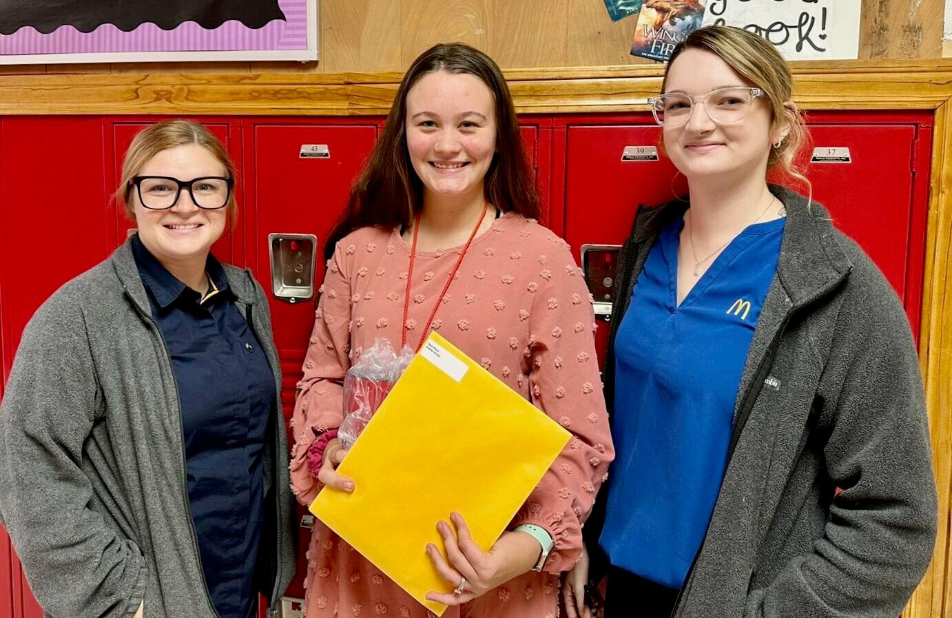 McDonald’s of West Plains General Manager Kayla Osburn, left, and McDonald’s of West Plains People Experience Lead Ashley Loucks, right, present the McDonald’s Outstanding Educator Award Recipient to West Plains Middle School fifth grade teacher Andrea Varney.