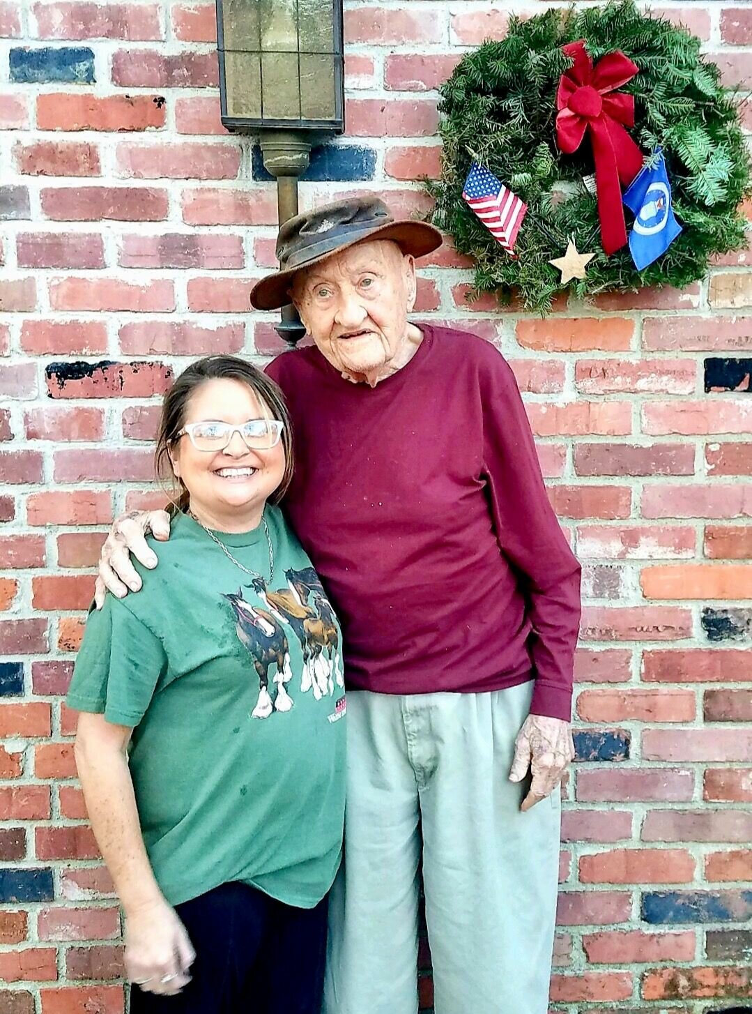 Jessica Joice-Frazier, left, West Plains, recently dropped by to visit friend Joe Spears, a World War II veteran, and present him a wreath in honor of his military service. Spears, also of West Plains, celebrated his 99th birthday Nov. 24.