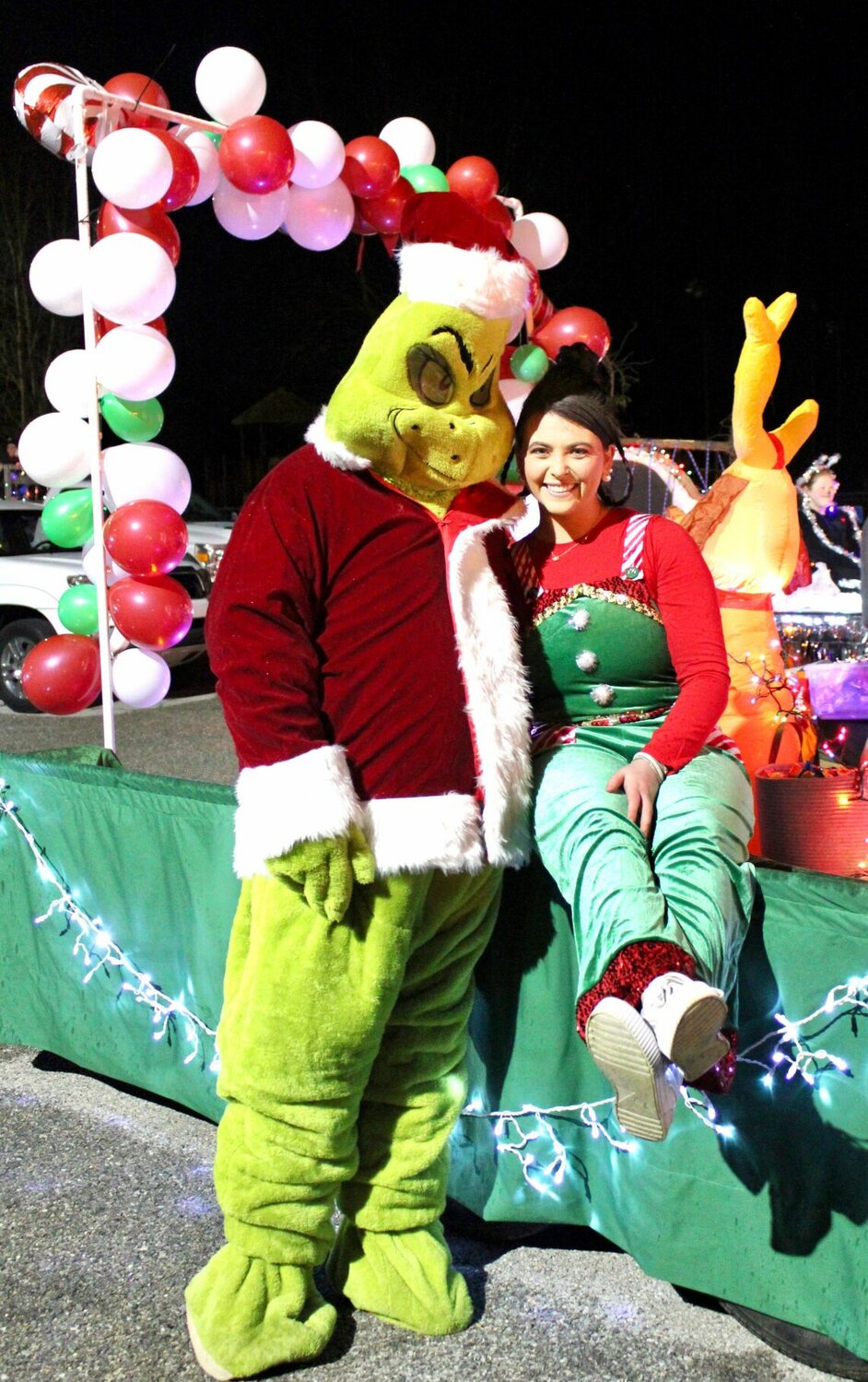 Willow Care Nursing Home entered this "Grinch" float in the movie-themed Willow Springs Christmas Parade Saturday evening. Kyle Dodson is costumed as the mean one himself and Makenzie Smith joined him as Cindy Lou Who.